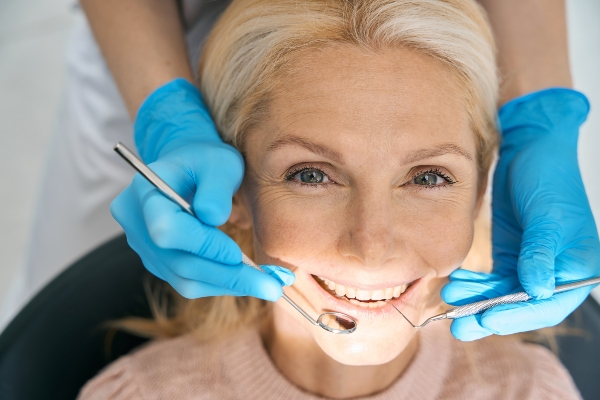 Dental Bridge Guide: How It Works, Pros/Cons, And How Long It Lasts